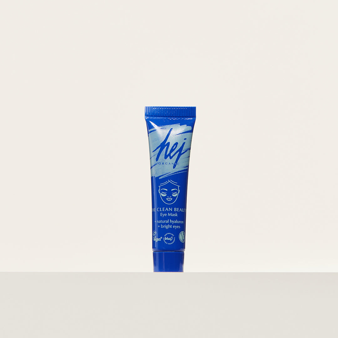 Blaue Tube mit der Aufschrift "Hey Organics Eye Mask" auf weißem Hintergrund.