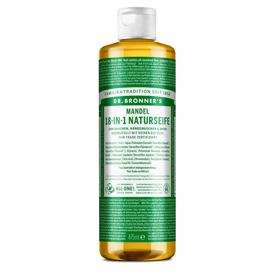 Eine 473-ml-Flasche Dr. Bronners 18-in-1 Naturseife Mandel Flüssigseife mit grün-weißem Etikett, auf dem Produktangaben und Gebrauchsanweisungen in deutscher Sprache stehen.