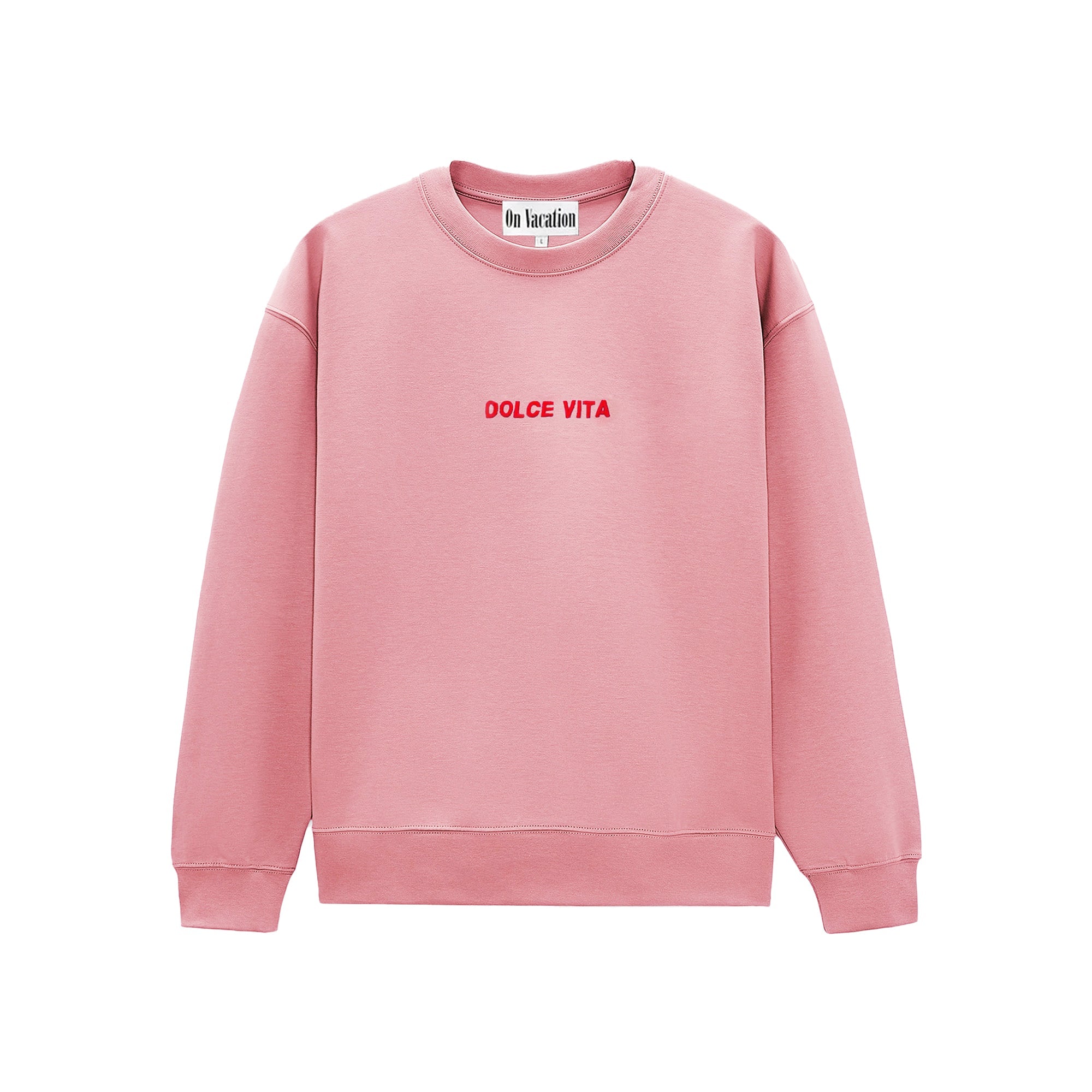 Ein rosa Sweatshirt mit Rundhalsausschnitt und dem Schriftzug DOLCE VITA in Rot auf der Vorderseite. Auf dem Etikett im Kragen steht On Vacation.