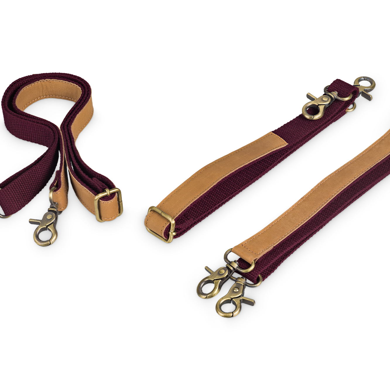 Bordeauxfarbene Taschenriemen mit braunen Lederdetails und Karabinerverschlüssen auf weißem Hintergrund.