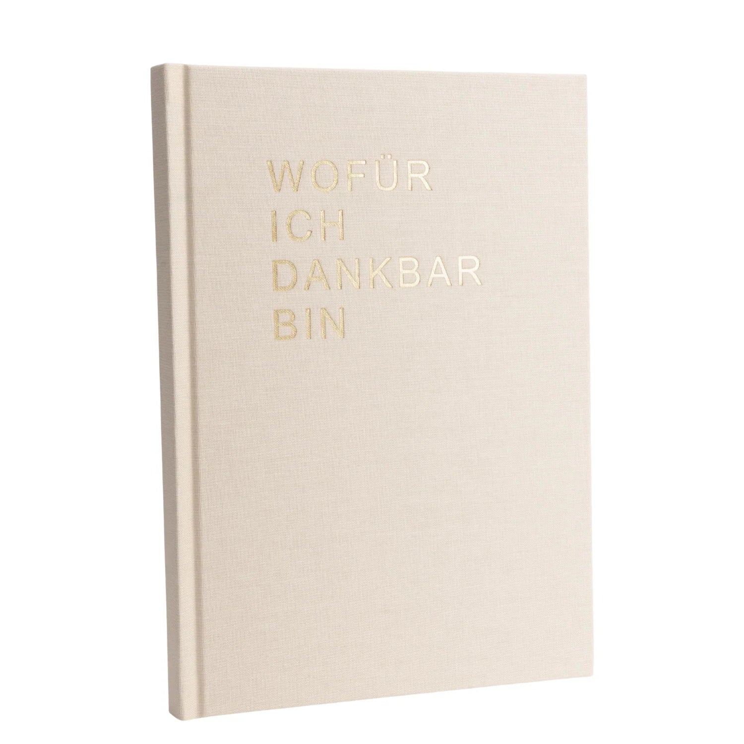 Ein beigefarbenes, gebundenes Buch mit dem Titel WOFÜR ICH DANKBAR BIN in goldgeprägten Buchstaben, das aufrecht vor einem weißen Hintergrund steht.