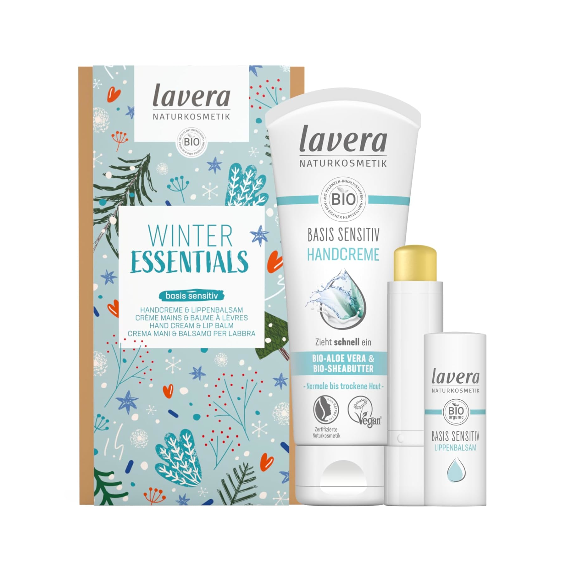 Ein Set von Lavera Naturkosmetik mit einer Handcreme, einem Lippenbalsam und einer dekorativen Box mit winterlichen Illustrationen und Texten in mehreren Sprachen.