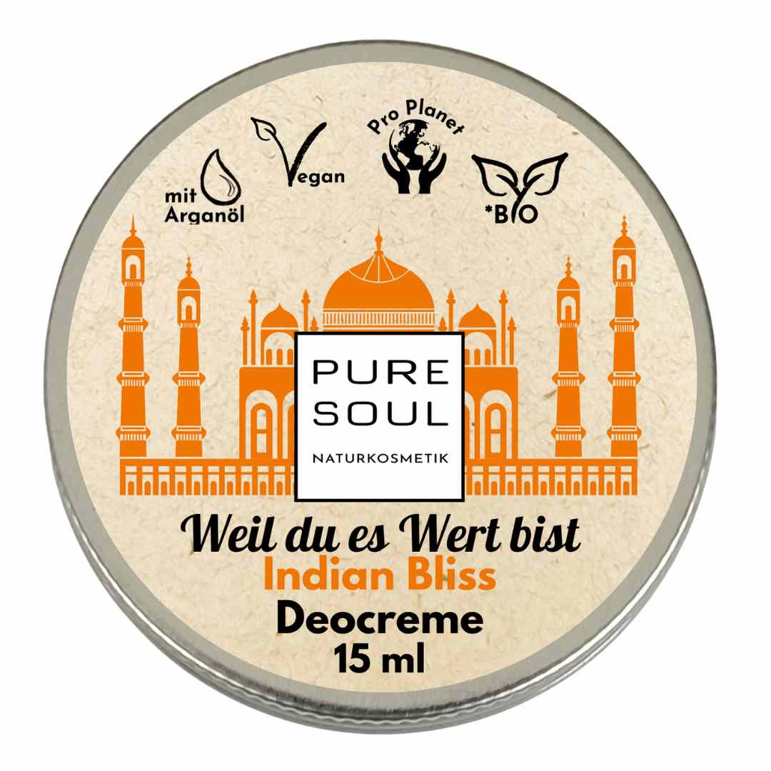 Runde Dose Pure Soul Naturkosmetik Deodorant mit der Aufschrift Indian Bliss, mit einer orangefarbenen Illustration des Taj Mahal und Symbolen für Arganöl, vegan, biologisch und umweltfreundlich. Größe 15 ml.