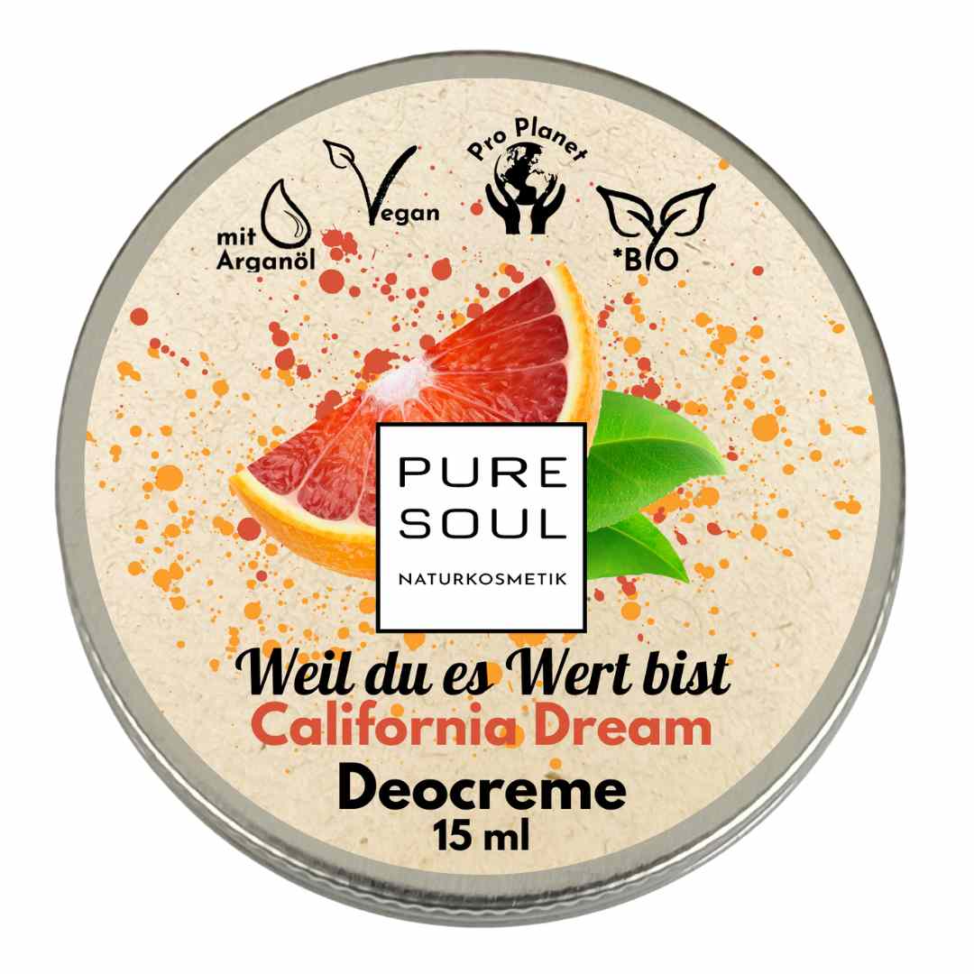 Runde Dose PURE SOUL Naturkosmetik Deocreme, 15 ml, mit einer Grapefruitscheibe und grünen Blättern auf beigem Hintergrund mit orangefarbenen Sprenkeln. Die Etiketten zeigen, dass sie vegan, biologisch, mit Arganöl und umweltfreundlich ist.
