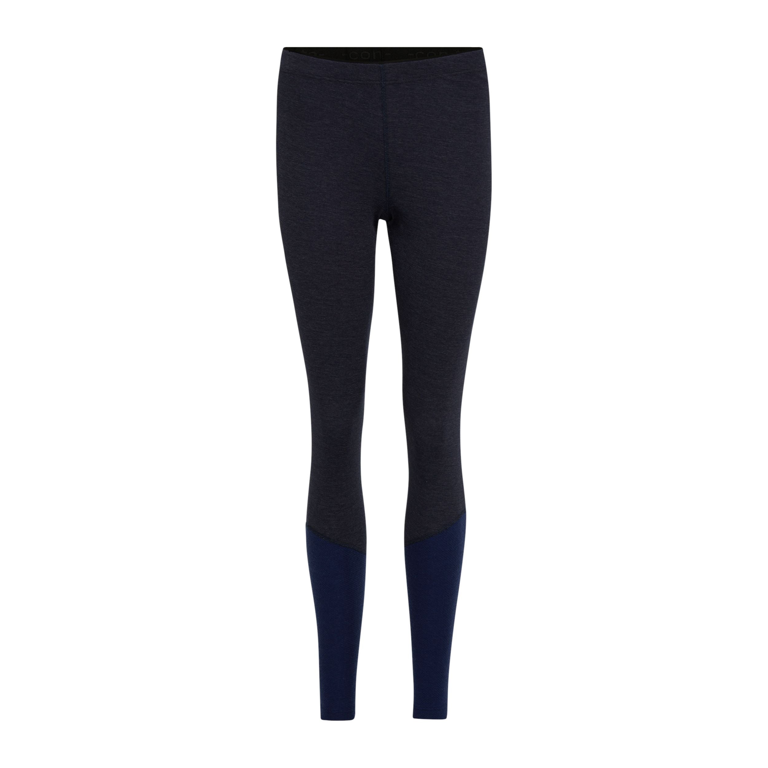 Ein Paar taillierte, dunkelgraue Leggings mit marineblauen Farbblöcken an den Unterschenkeln auf weißem Hintergrund.